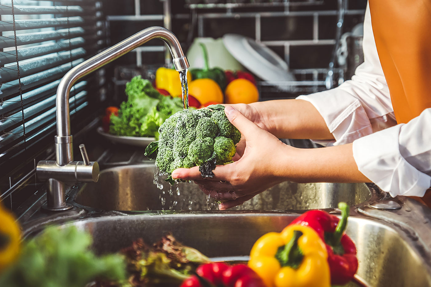washing vegetables in filtered tap water